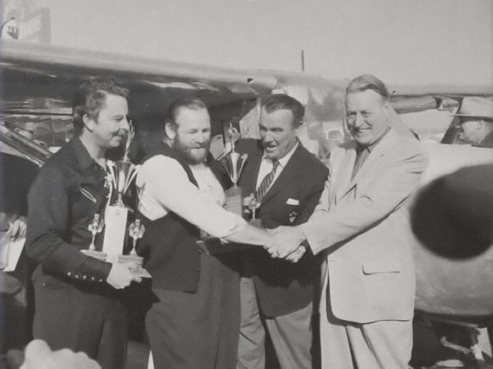 Left to right: John Cook, Bob Timm, actor Preston Foster, Doc Bayley